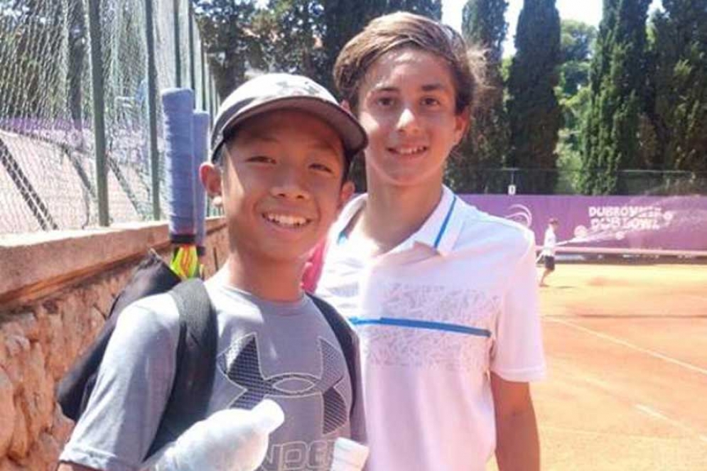 Eli junto a su compa&ntilde;ero de dobles, el estadounidense Quang Doung.